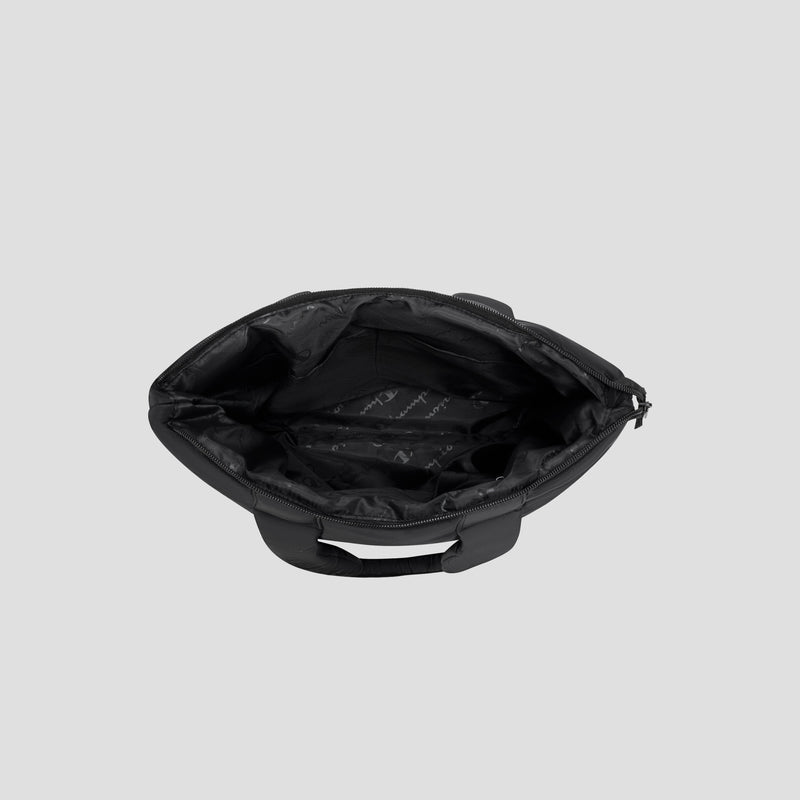 The Champion Quilted Billie Tote is photographed from above, revealing its spacious, empty interior lined with black fabric and subtle branding. Set against a plain light gray background, this stylish bag is perfect for everyday use.