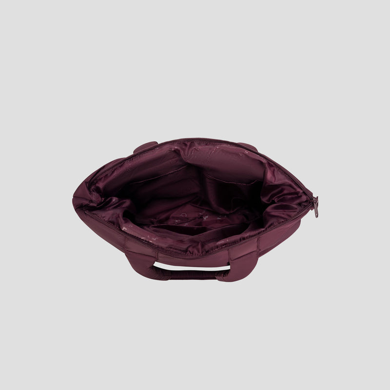 A top-down view of the Champion Quilted Billie Tote in open maroon, featuring a chic quilted design, multiple inner pockets, and a secure zipper closure. The empty interior is displayed against a light gray background—making it an ideal choice for everyday use.