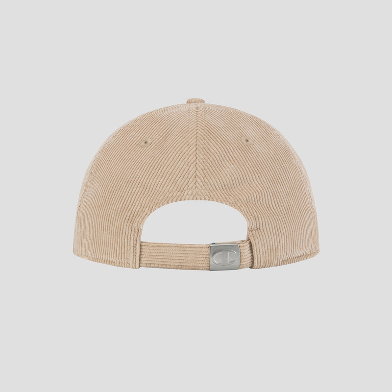 The Ridge Corduroy Adjustable Cap by Champion is shown from the back, highlighting its vintage-inspired beige corduroy design and an adjustable closure with a silver buckle.