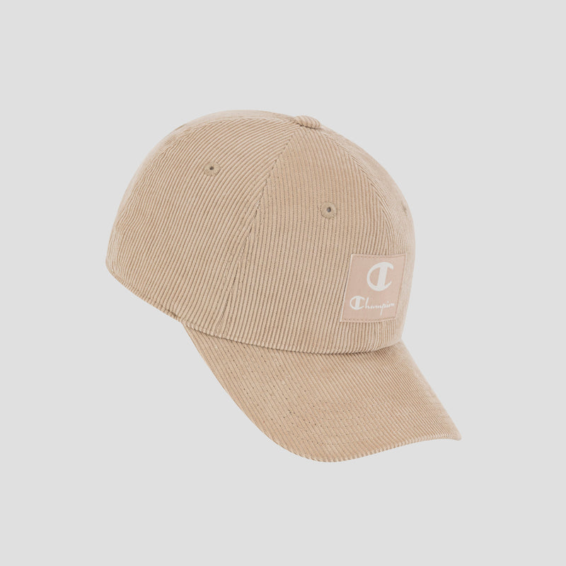 Introducing the Ridge Corduroy Adjustable Cap by Champion—a beige corduroy hat with a curved brim and a Champion logo patch on the front. Designed for comfort, it features an adjustable back closure and offers vintage-inspired style, showcased here against a plain white background.