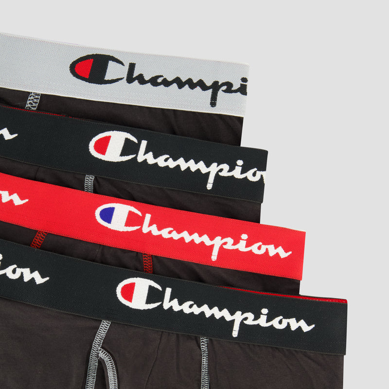 The Champion 4Pk Cotton Stretch Boxer Brief set includes four men's underwear pairs, each with a different colored waistband—grey, navy, red, and black—featuring the Champion logo on soft stretch cotton.