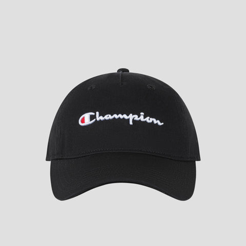 A black washed cotton twill Script Embroidery Adjustable Cap by Champion, featuring the brand’s name embroidered in white and red script on the front, is displayed against a plain light gray background.