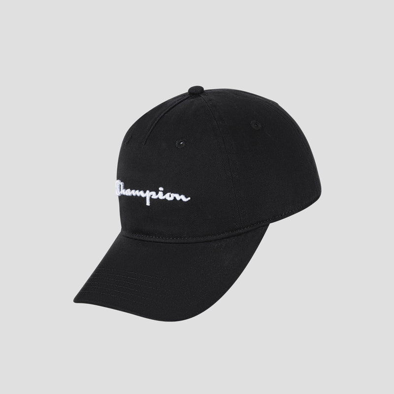 The Script Embroidery Adjustable Cap by Champion is crafted from washed black cotton twill and features white “Champion” script embroidery on the front, displayed against a light gray background.