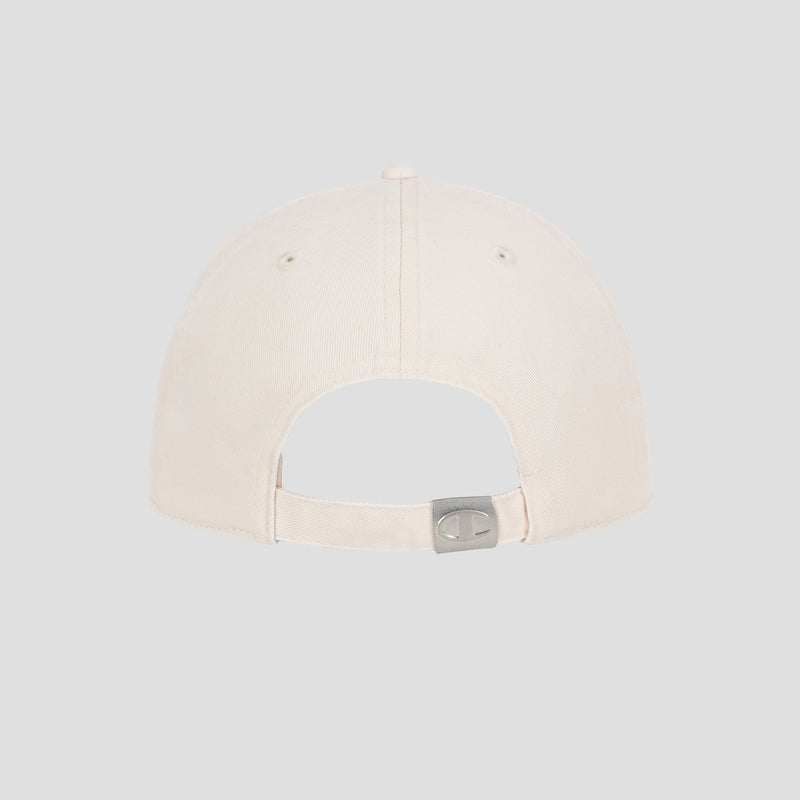 A Champion Script Embroidery Adjustable Cap in beige is shown from the back, highlighting its adjustable strap with a metal clasp. Crafted from premium washed cotton twill, the cap is set against a plain light gray background.