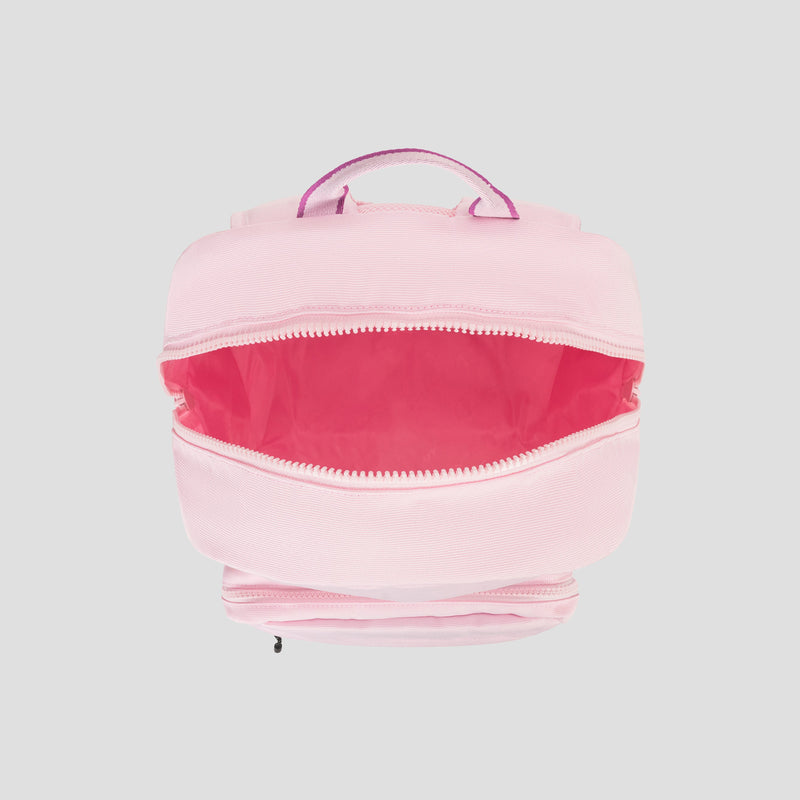 A light pink Champion Steady Backpack with a zippered main compartment, partially open to reveal a bright pink interior and a padded laptop sleeve. The bag features a matching pink handle on top and is set against a plain gray background.