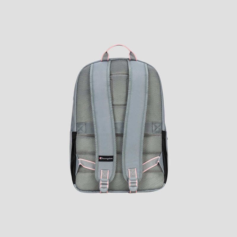 The Champion Steady Backpack in gray, featuring padded shoulder straps and pink accents, is displayed from the back against a plain light gray background. The design includes mesh padding and a small black Champion logo near the bottom.