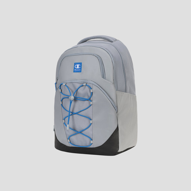 The Champion Summit Backpack features a light gray and black design with a blue Champion logo, multiple zippered compartments, a weather-resistant finish, and a distinctive blue bungee cord detail on the front. It also includes a padded laptop sleeve for added protection.