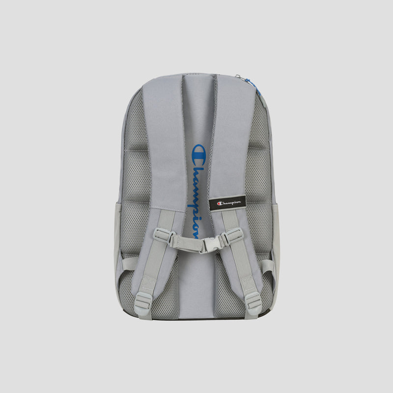 The Summit Backpack by Champion is shown from the back, featuring padded shoulder straps, an adjustable chest strap, mesh padding, and the blue Champion logo vertically positioned between the straps. This weather-resistant design also includes a padded laptop sleeve for added protection and convenience.