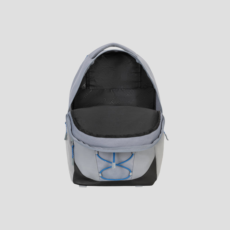 The Champion Summit Backpack is displayed in grey and black with its main compartment open, revealing a spacious, empty interior. This premium backpack features blue stitching, a padded laptop sleeve for added protection, weather-resistant material, and a front pocket with a unique blue design.