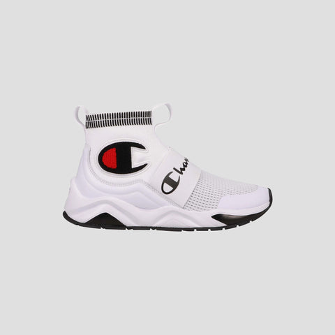 The Kids' Rally Pro by Champion are white slip-on shoes with a comfy high mesh ankle collar, black and red Champion logo on the side, and thick white sole with black tread, shown against a plain light gray background.