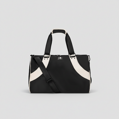 Black and white handbag with a visible brand logo on a light gray background
