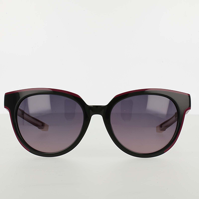 Sunglasses with a black and red frame on a white background