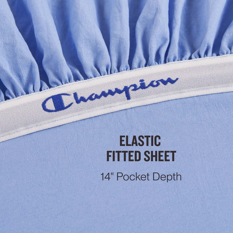 Close-up of the Champion Elastic Logo Microfiber Sheet Set in light blue, featuring an elastic band with embroidered Champion logo detail. Text reads: ELASTIC FITTED SHEET 14″ Pocket Depth.