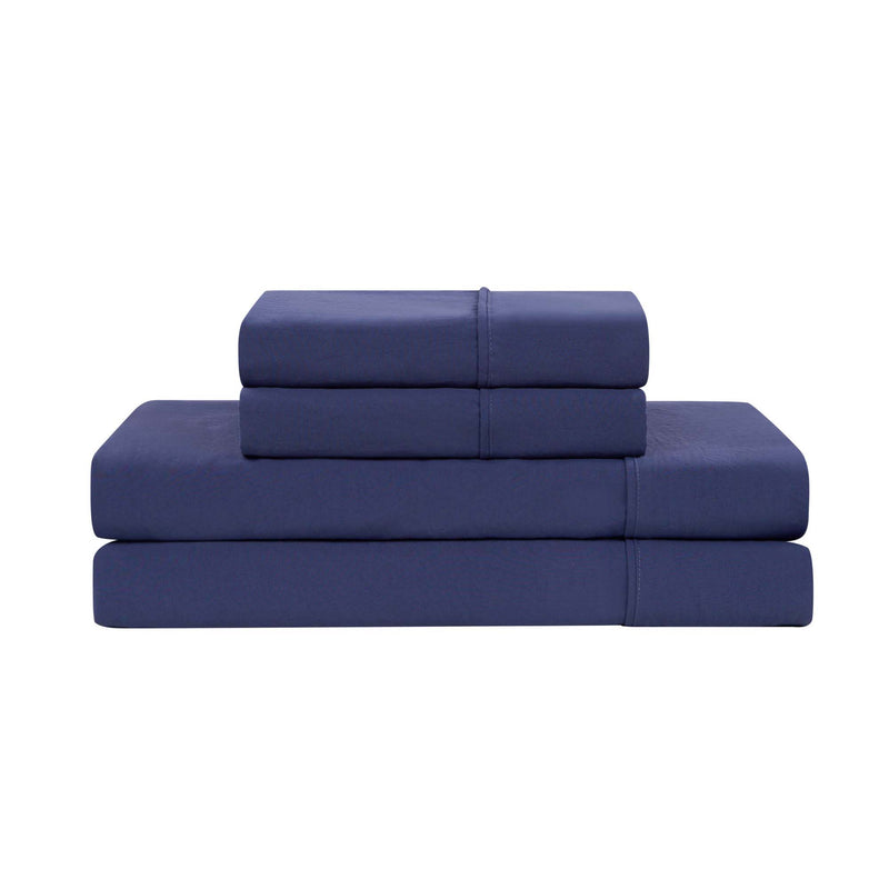 A neatly folded Champion Elastic Logo Microfiber Sheet Set in navy blue, including pillowcases, stacked on a white background.