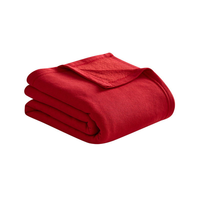 A neatly folded Champion Jersey with Fleece Backing Throw Blanket in bright red is displayed on a white background.