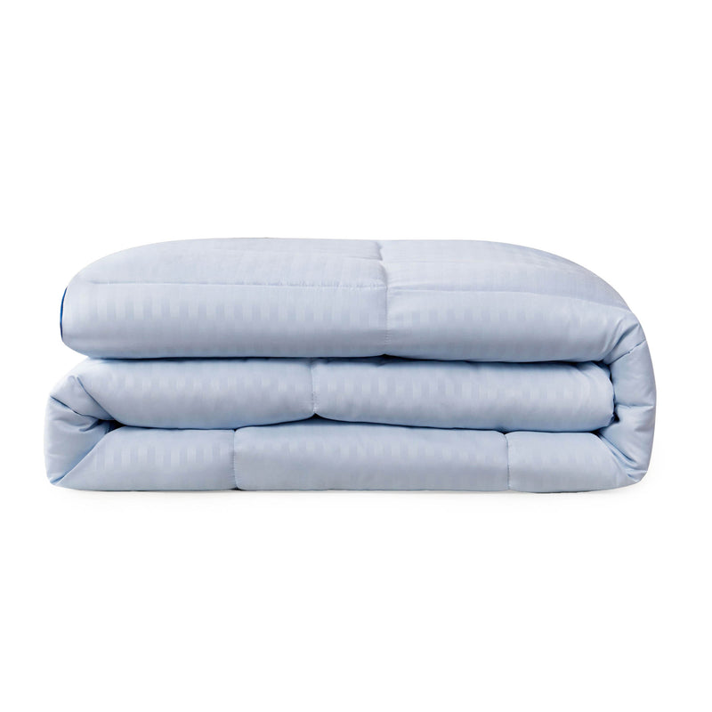 The Champion Blue Cooling Down Alternative Comforter is neatly folded and displayed against a plain white background.