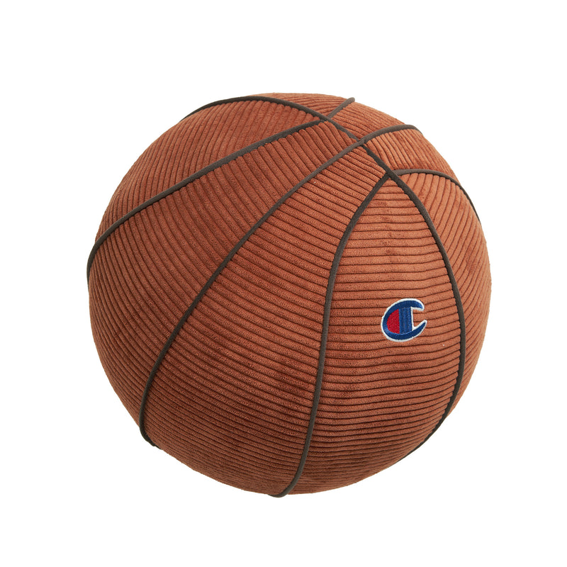 This Sport Shaped Pillow by Champion features a brown corduroy basketball design with dark seams and a small embroidered Champion logo on the side, making it a distinctive accent piece shown isolated on a white background.