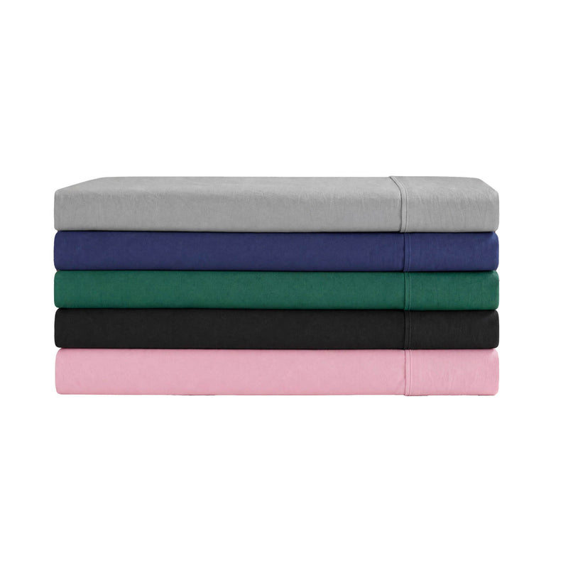 A neatly arranged stack of five folded Champion Peak Comfort Microfiber Sheet Sets, in gray, navy blue, green, black, and pink, is displayed against a white background. These deep pocket sheets offer enhanced durability and comfort for an elevated athletic bedding experience.
