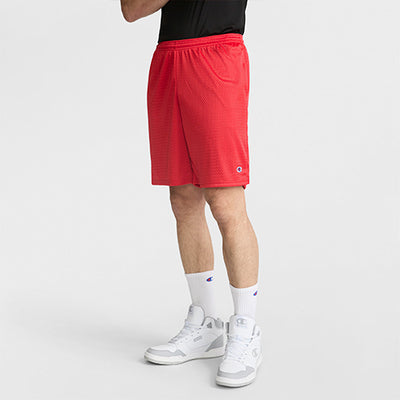 Person wearing red shorts with a brand logo on a white background