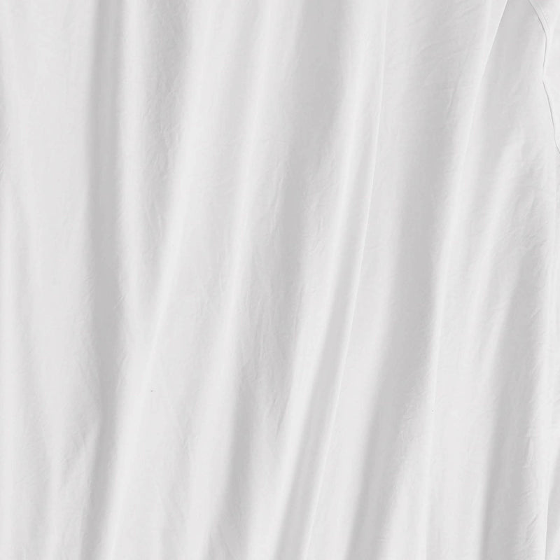 A close-up of a white fabric with soft, vertical folds and subtle wrinkles reveals a slightly textured appearance—beautifully illustrating the smooth feel of the Champion Embroidery Patch Microfiber Sheet Set for athletic-inspired bedding.
